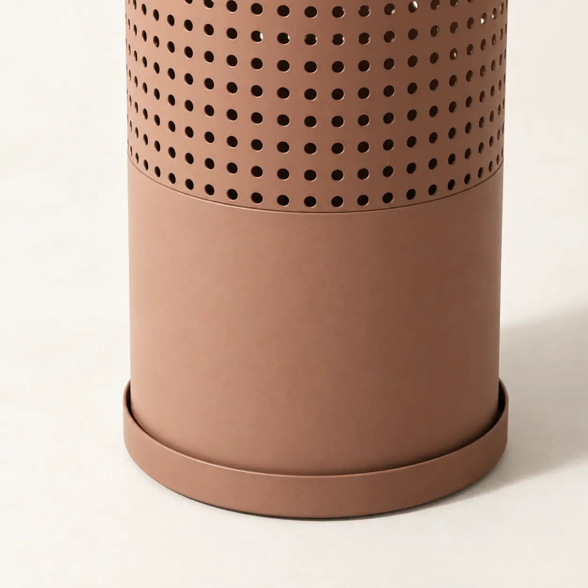 Cove Umbrella Stand, detail of regular perforations and removable drip tray
