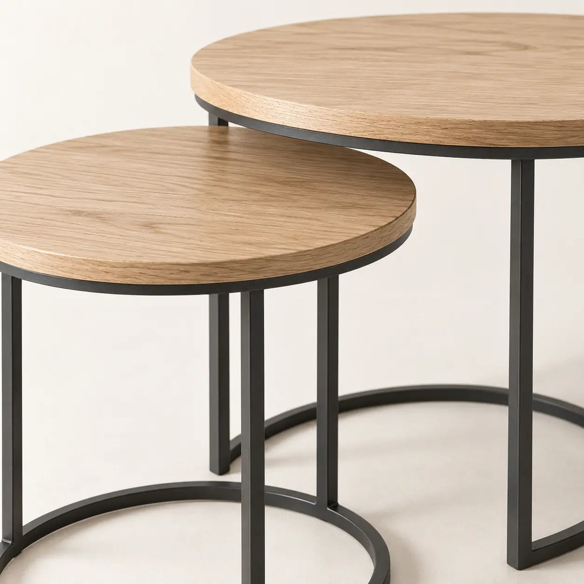 Nori Nesting Tables, detail of two distinct table heights and thin steel frames