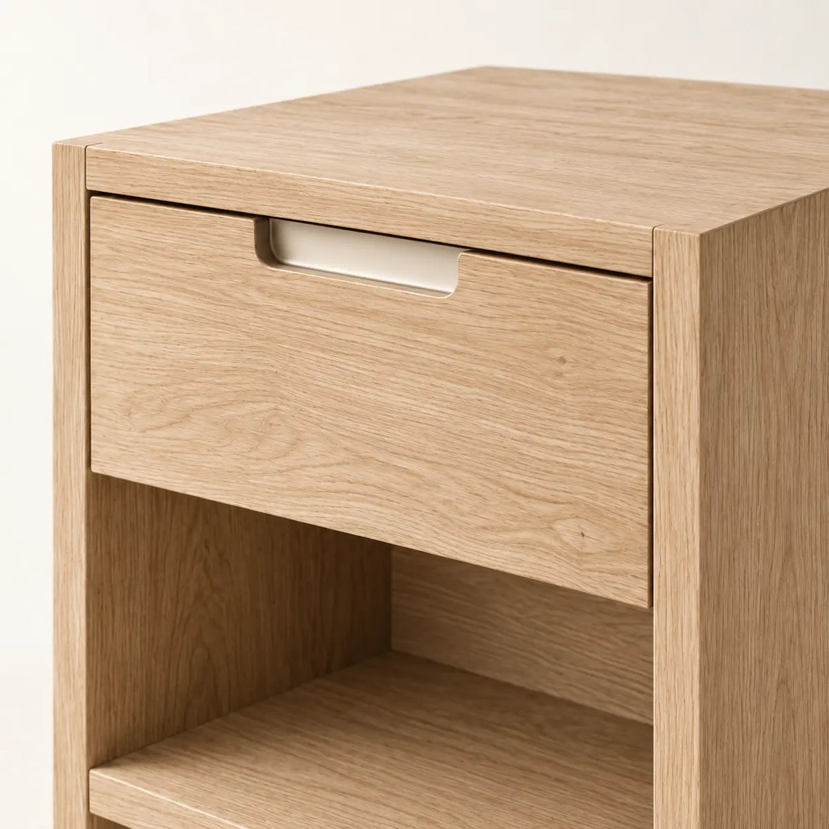 Solace Bedside Cabinet, detail of recessed drawer pull and continuous side panels